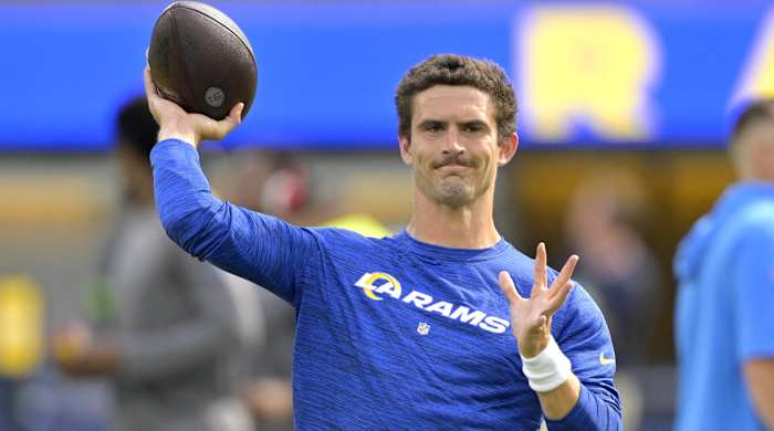Rams quarterback Stetson Bennett throws a pass during warmups before a game.